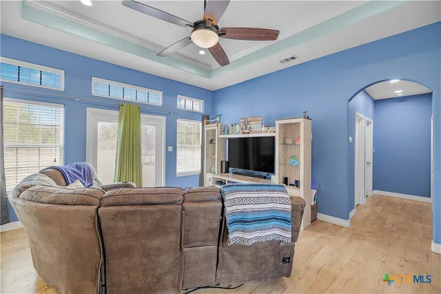 a living room with furniture and a flat screen tv