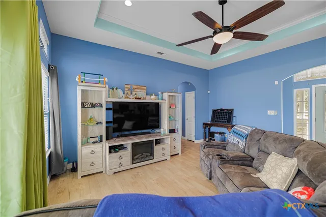 a living room with furniture and a flat screen tv