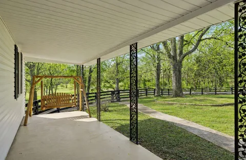 a view of outdoor space with deck and mountain view