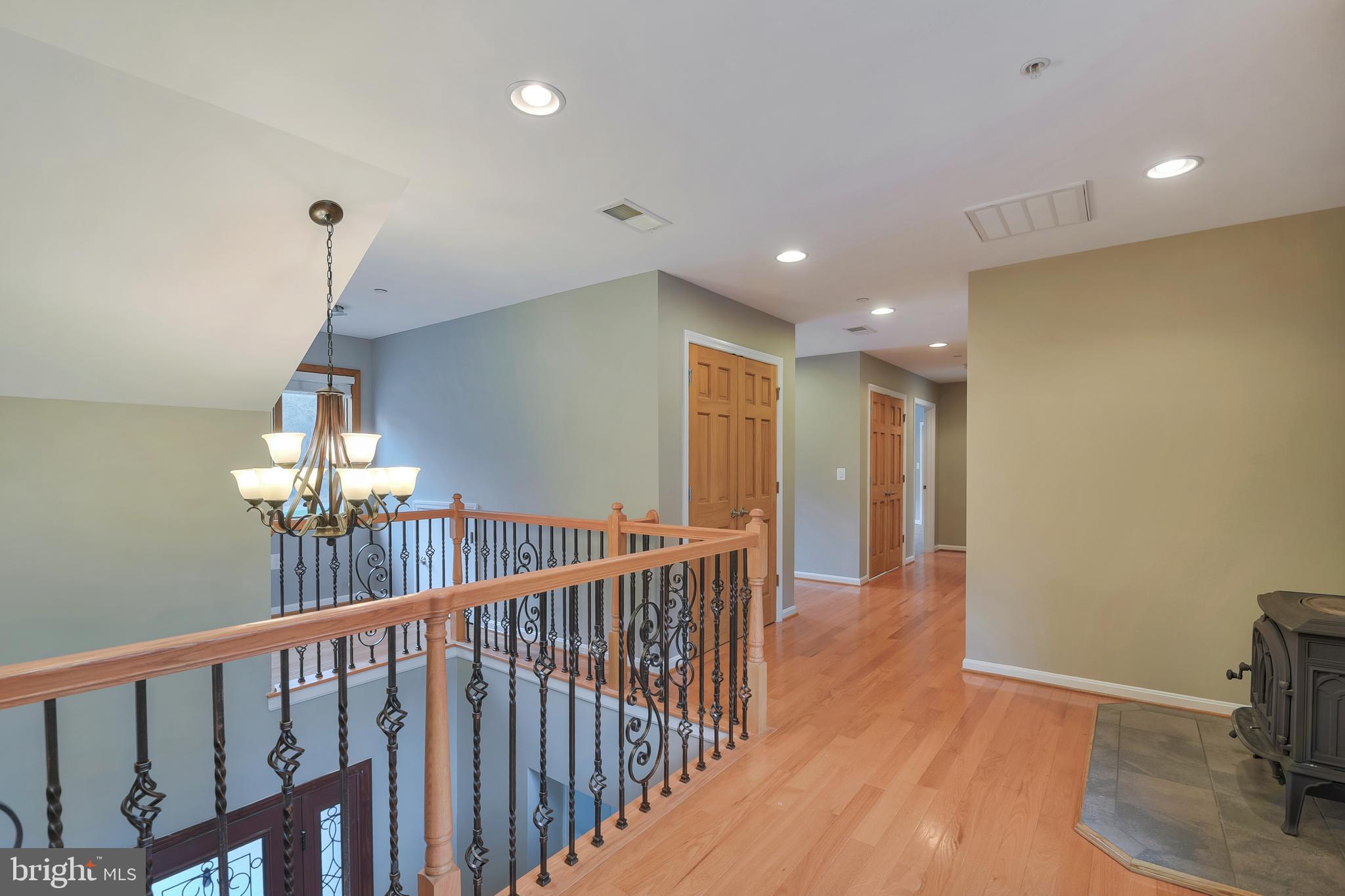 7715 Paradise Beach Road Pasadena, MD 21122 - Photo 14 of 62 a view of a hallway with a livingroom and chandelier