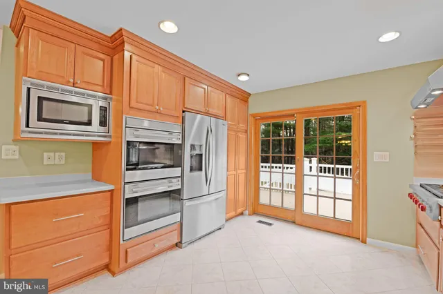 a view of a kitchen with an oven and cabinets