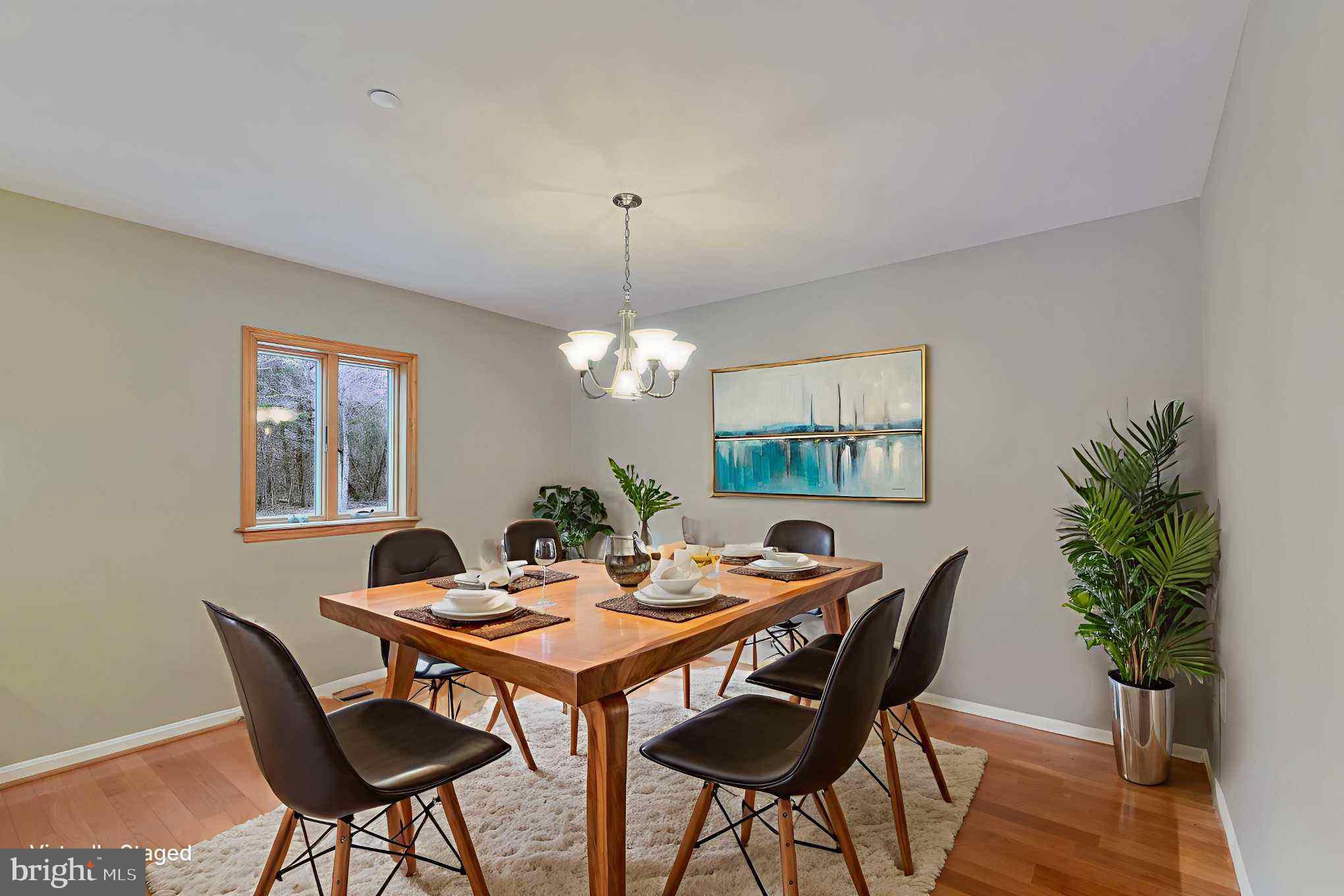 7715 Paradise Beach Road Pasadena, MD 21122 - Photo 16 of 66 a view of a dining room with furniture window and wooden floor