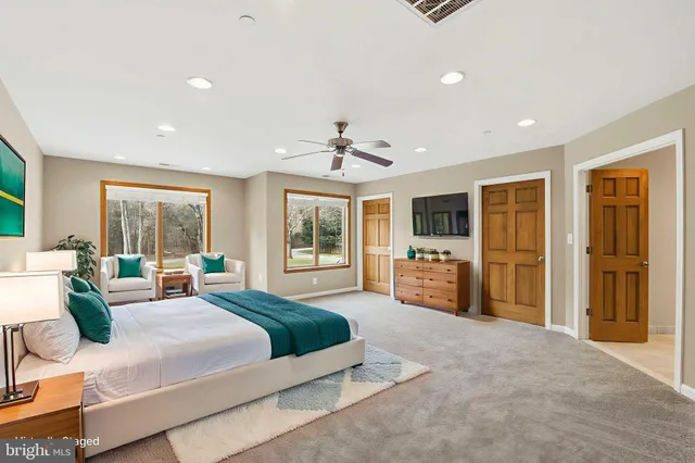 a view of a room with wooden floor and chandelier