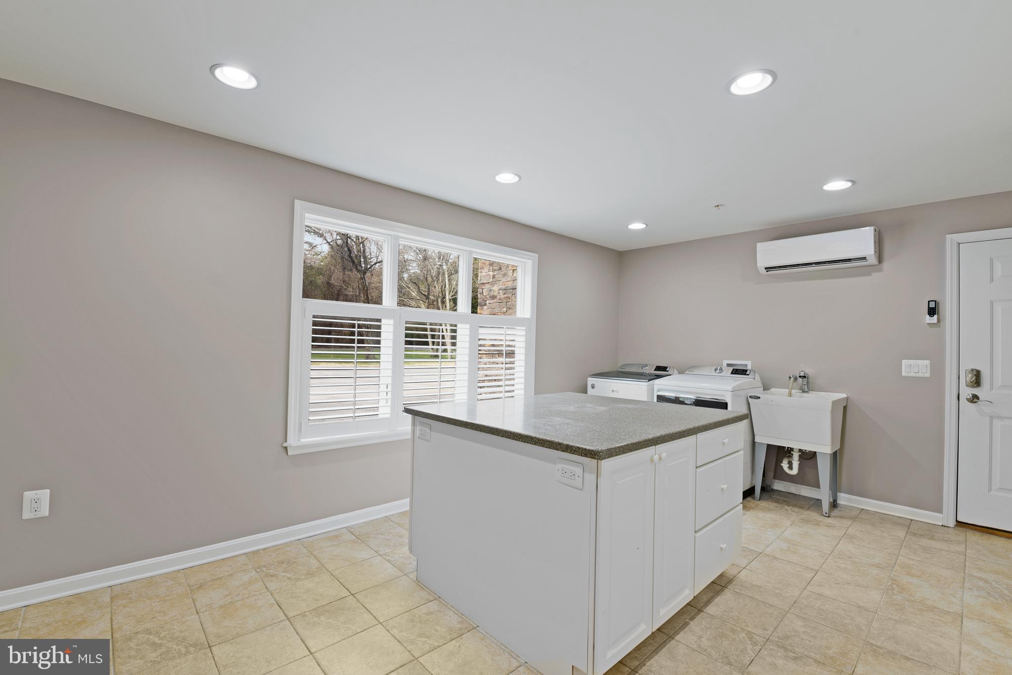 7715 Paradise Beach Road Pasadena, MD 21122 - Photo 23 of 62 LAUNDRY ROOM OFF GARAGE WITH LAUNDRY SHOOT