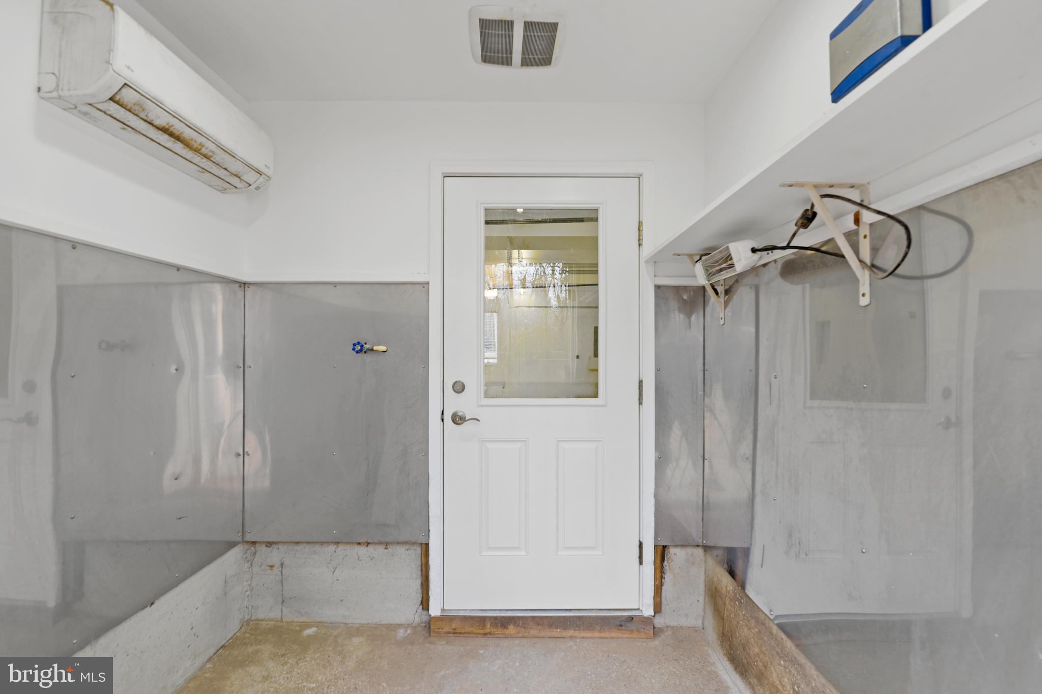 7715 Paradise Beach Road Pasadena, MD 21122 - Photo 26 of 66 HEATED PET ROOM WASH AREA & DOGGY DOOR TO YARD