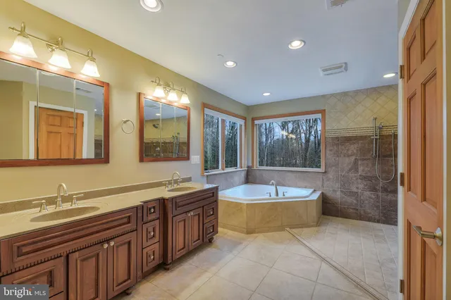 a bathroom with a tub sink and toilet