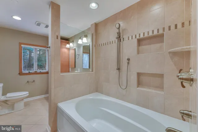 a view of a room with wooden floor and furniture