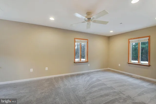 a view of a swimming pool with an outdoor space and seating area