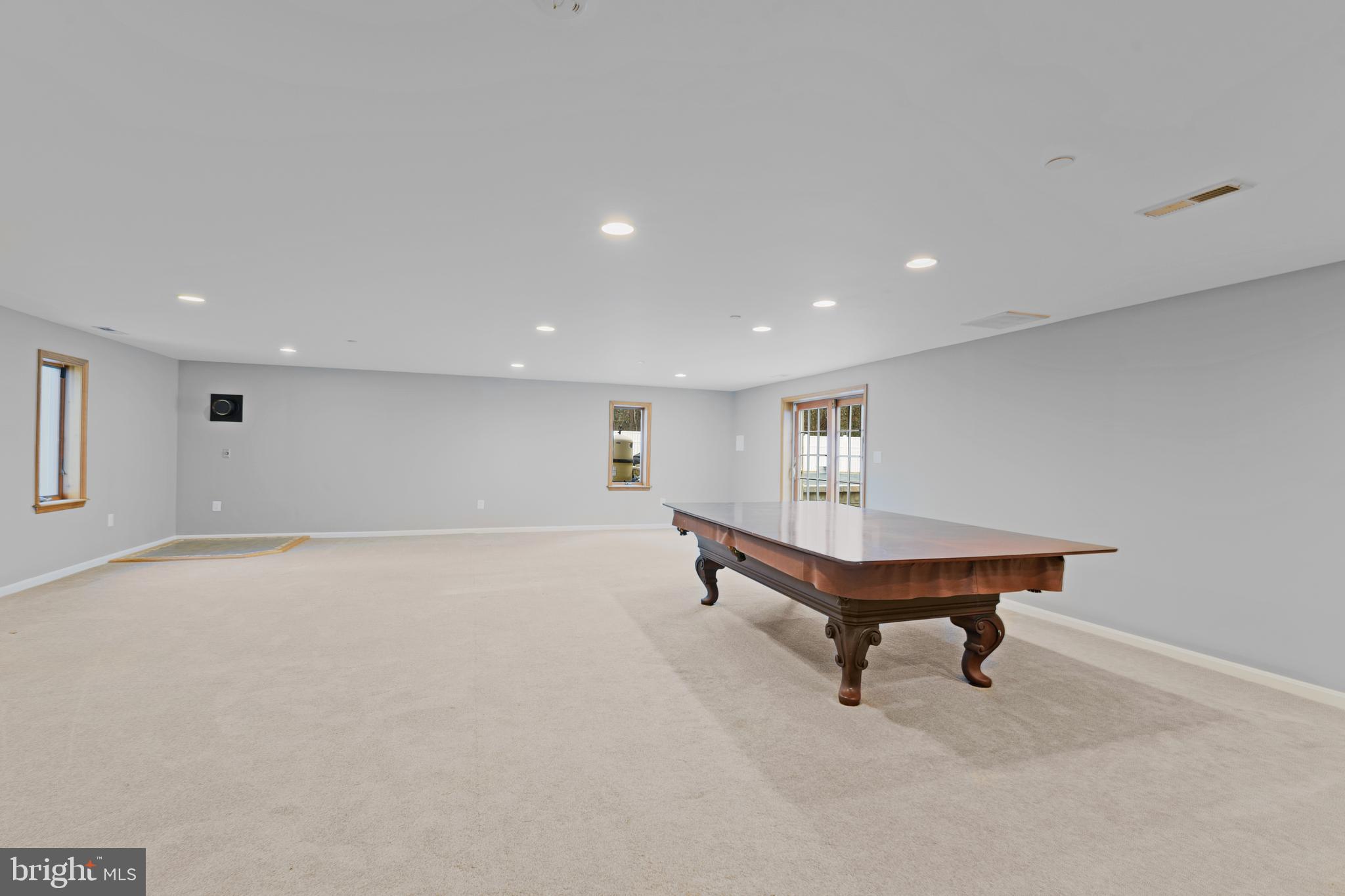 7715 Paradise Beach Road Pasadena, MD 21122 - Photo 43 of 66 a view of a room with wooden floor and furniture