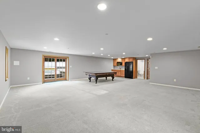 a view of a swimming pool with an outdoor space and seating area