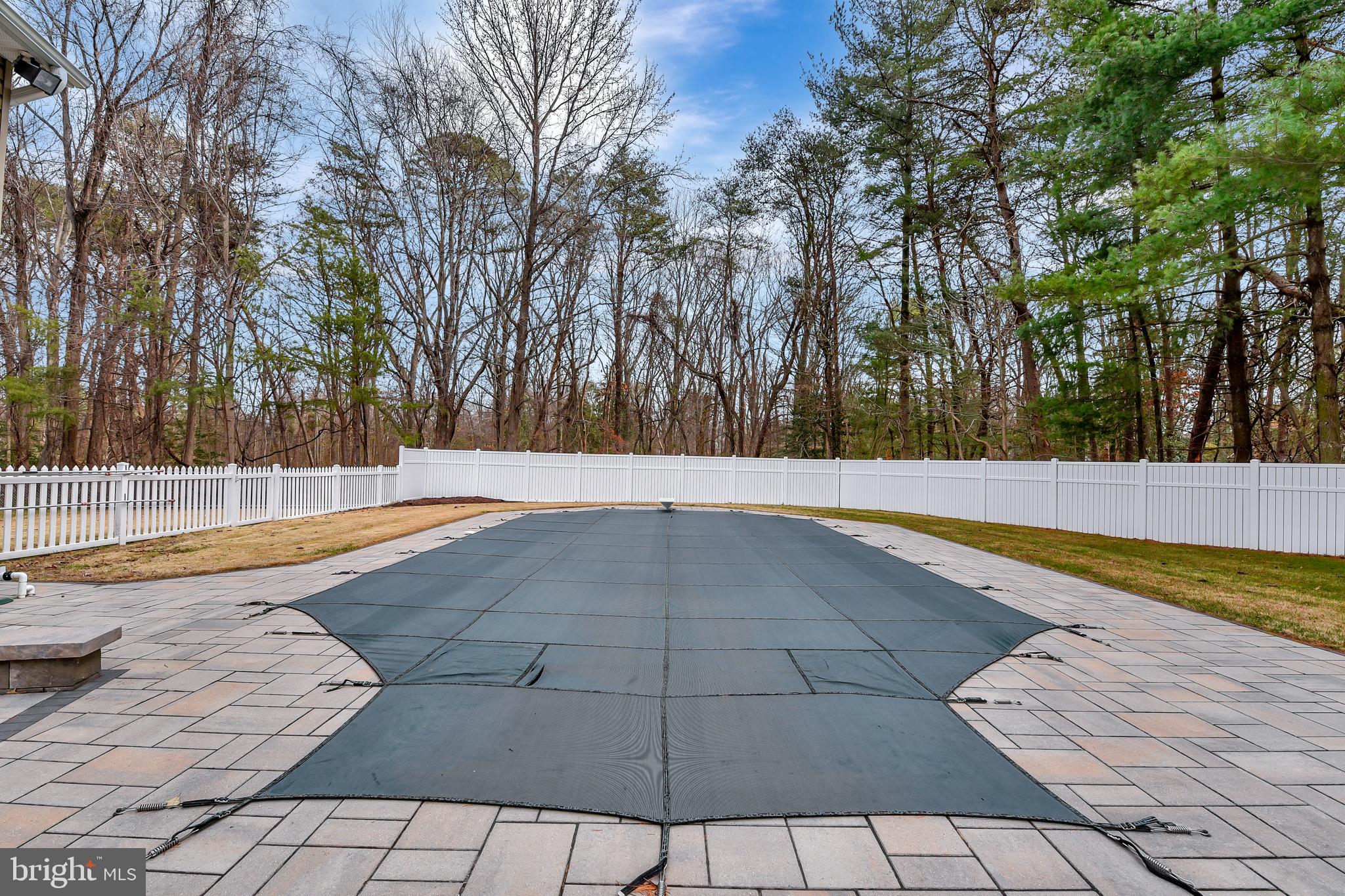 7715 Paradise Beach Road Pasadena, MD 21122 - Photo 51 of 66 a view of a swimming pool with an outdoor space and seating area