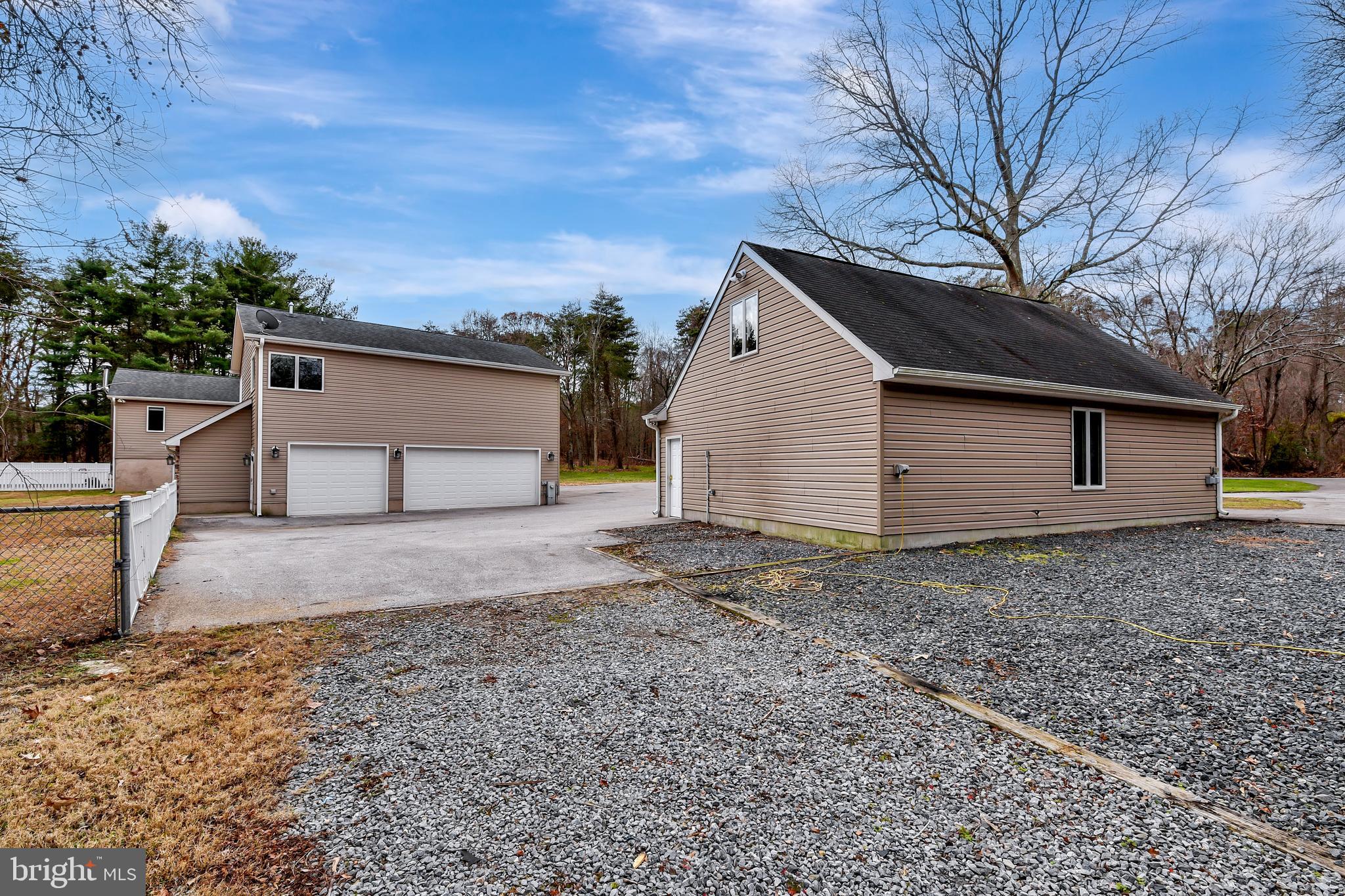 7715 Paradise Beach Road Pasadena, MD 21122 - Photo 7 of 62 a view of a backyard with a barn