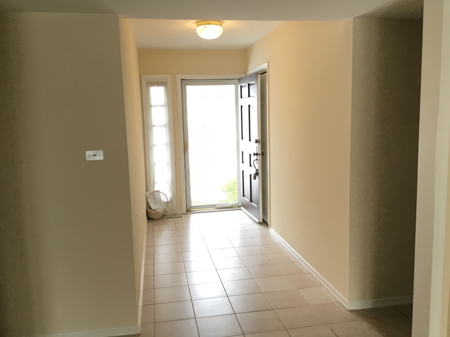 845 Heather Lane Hoffman Estates, IL 60169 - Photo 2 of 14 a view of a hallway with wooden floor and a window