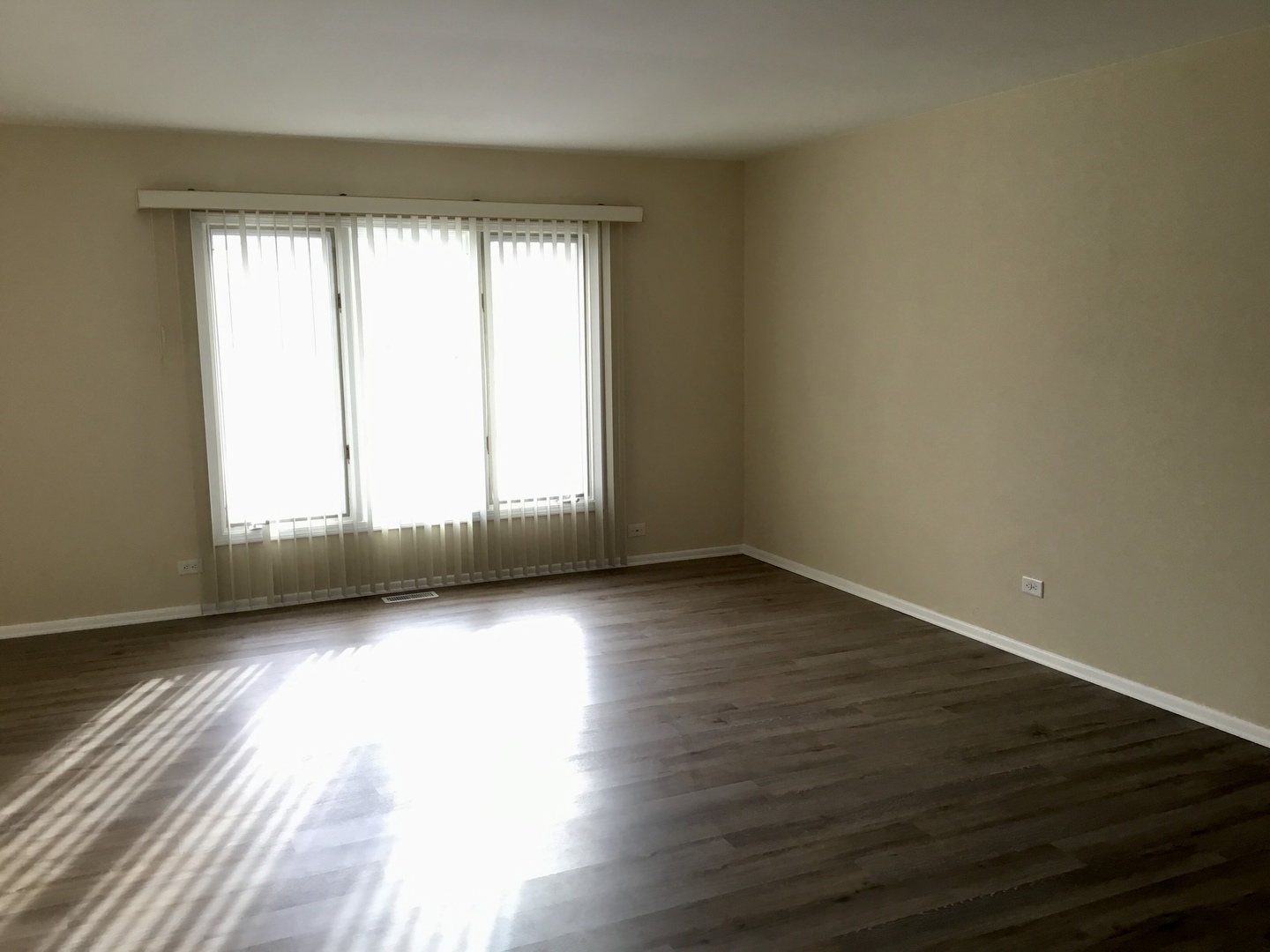 845 Heather Lane Hoffman Estates, IL 60169 - Photo 5 of 14 a view of an empty room with wooden floor and a window