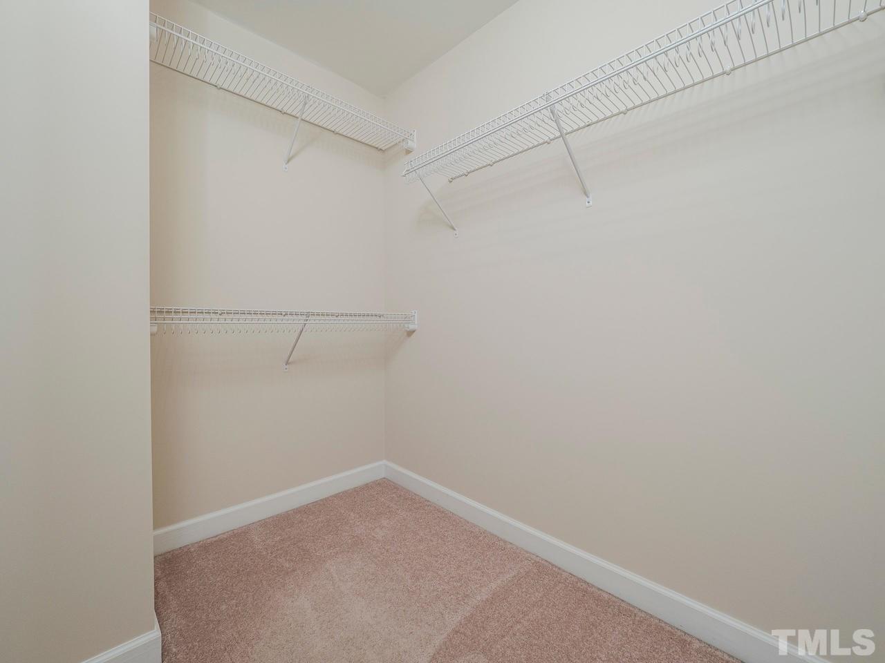 6025 Four Townes Lane Raleigh, NC 27616 - Photo 18 of 24 a view of a room with racks on the wall