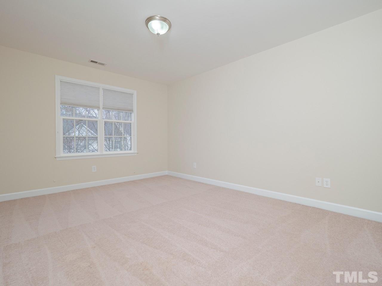6025 Four Townes Lane Raleigh, NC 27616 - Photo 19 of 24 an empty room with a window
