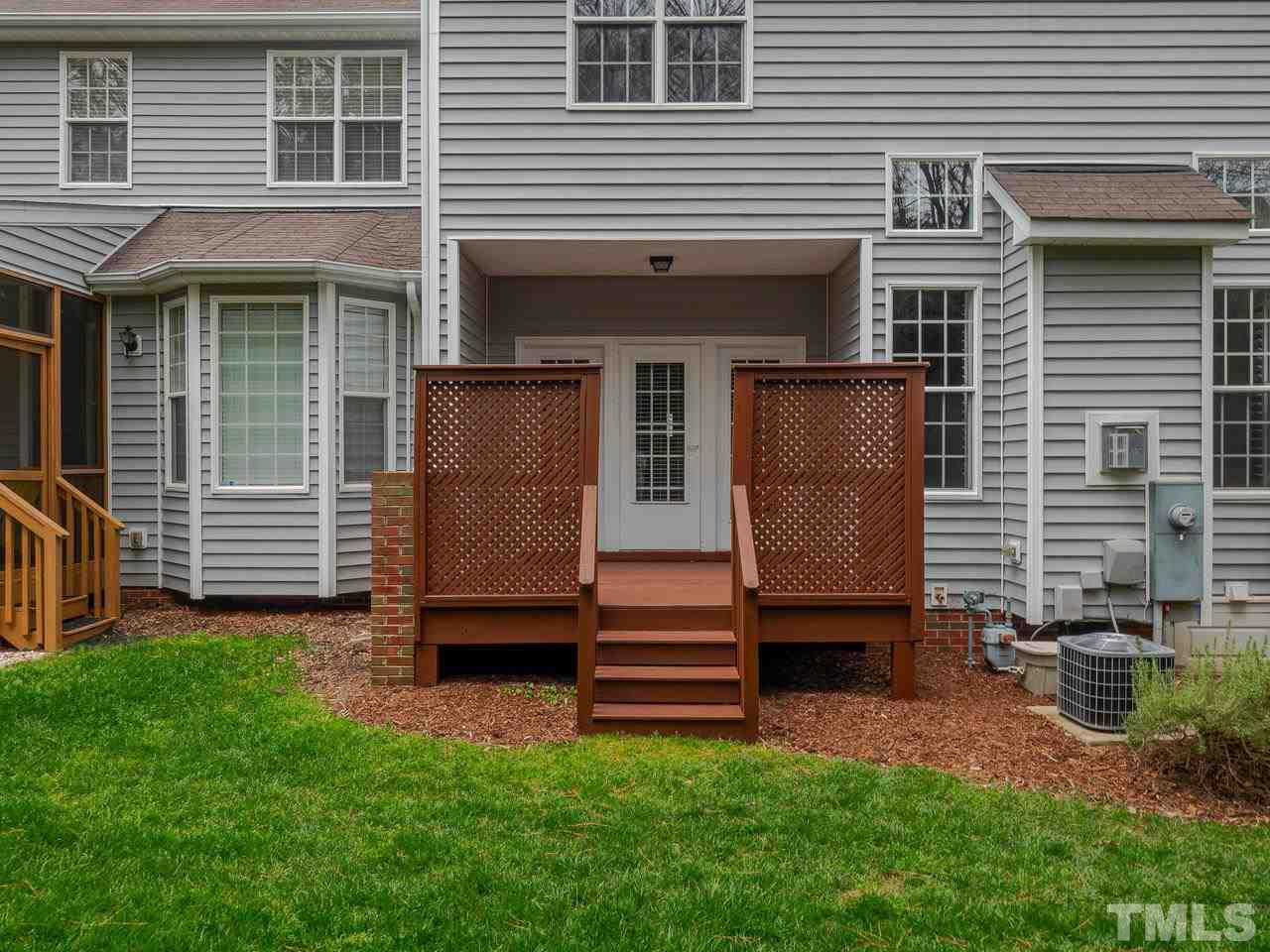 6025 Four Townes Lane Raleigh, NC 27616 - Photo 23 of 24 a front view of a house with a yard
