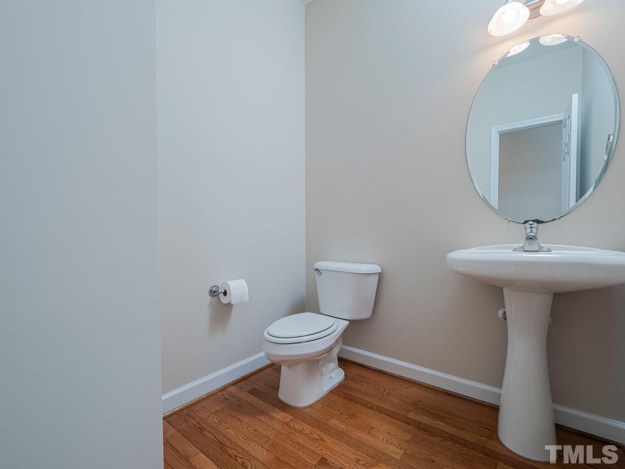 6025 Four Townes Lane Raleigh, NC 27616 - Photo 5 of 24 a bathroom with a sink and a toilet