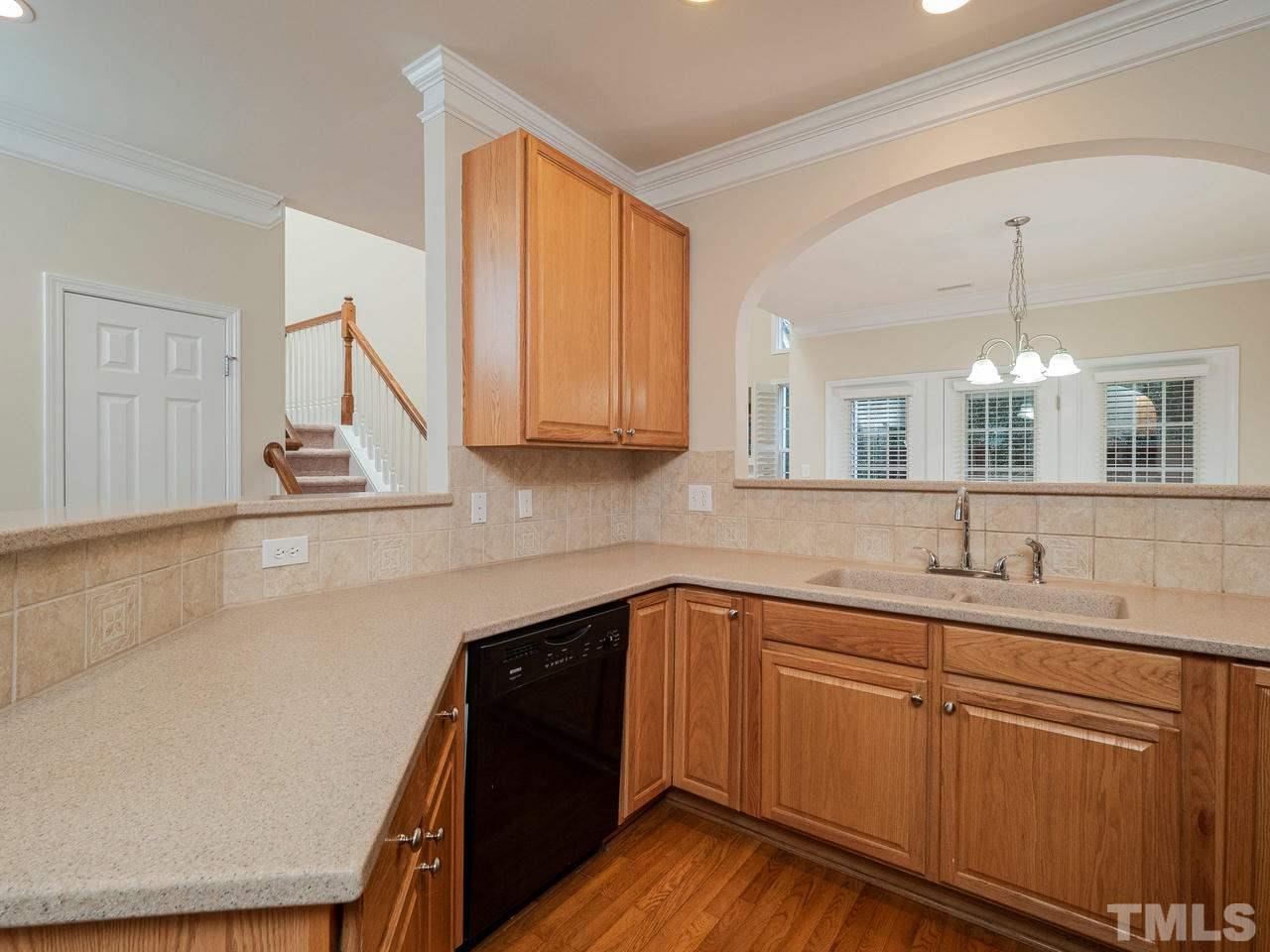 6025 Four Townes Lane Raleigh, NC 27616 - Photo 9 of 24 a kitchen with a sink and cabinets