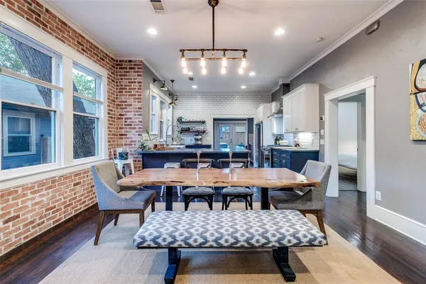 a outdoor space with lots of furniture a rug and a chandelier