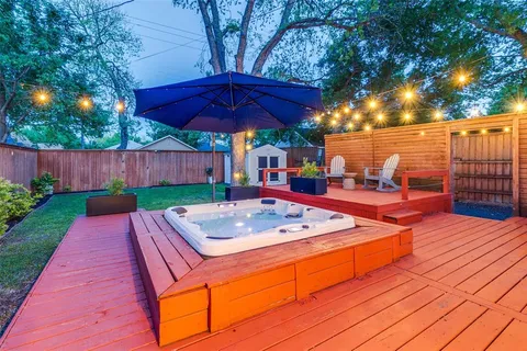 a view of a backyard with sitting area