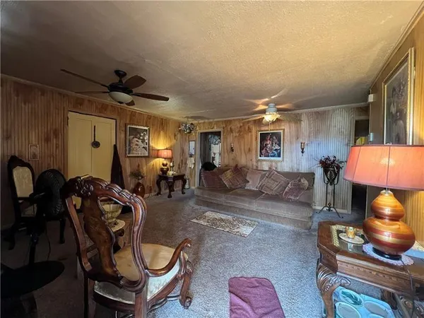 a room with furniture and a lamp