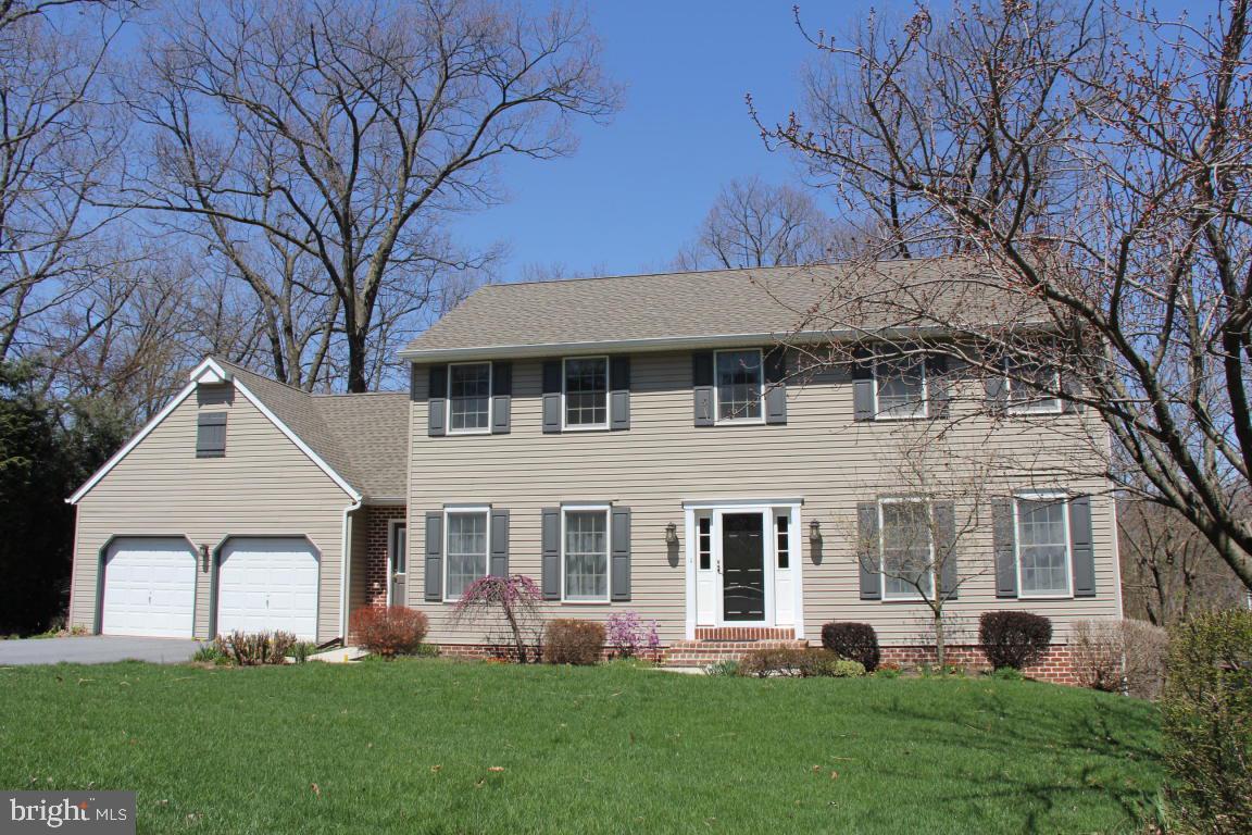 3 Warren Circle Lititz, PA 17543 - Photo 1 of 27 a front view of a house with a garden and trees