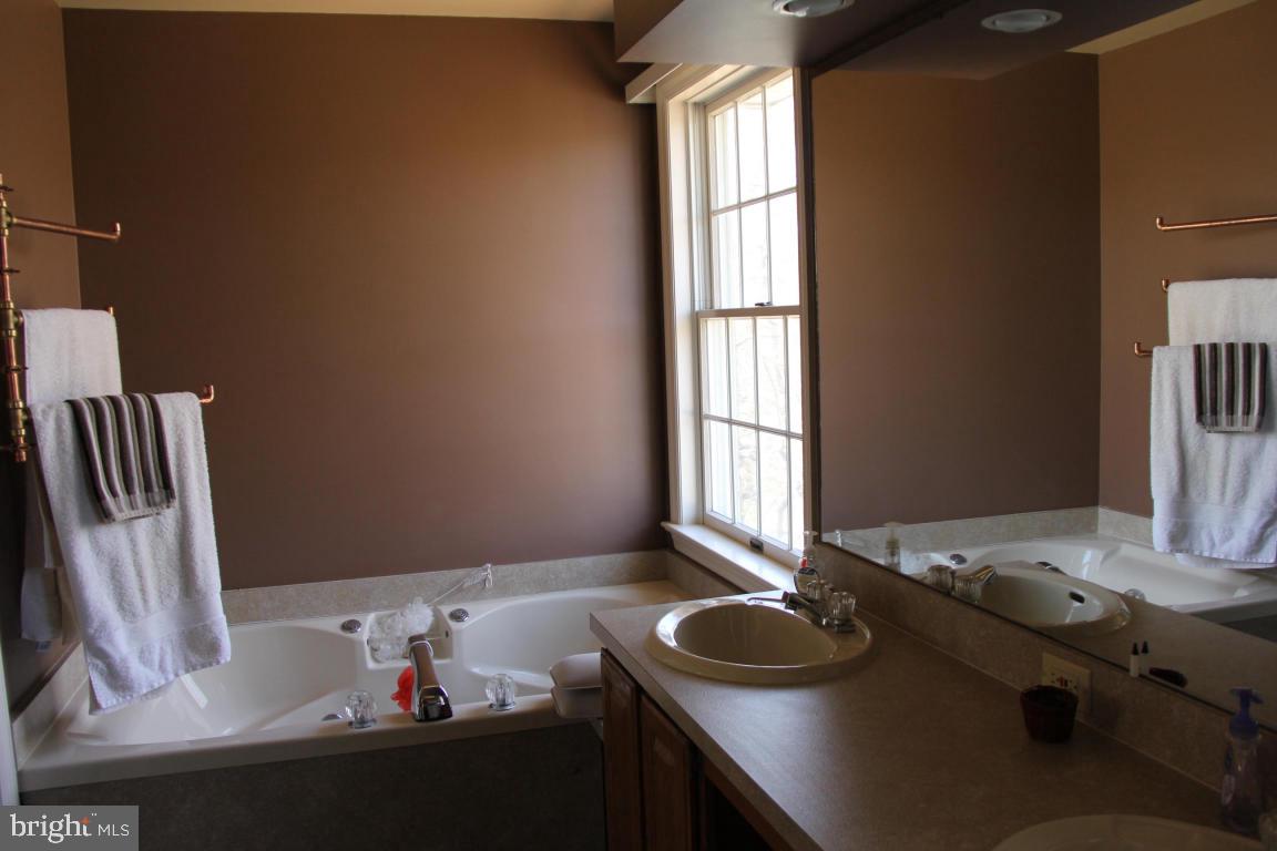 3 Warren Circle Lititz, PA 17543 - Photo 14 of 27 a bathroom with a sink and a window