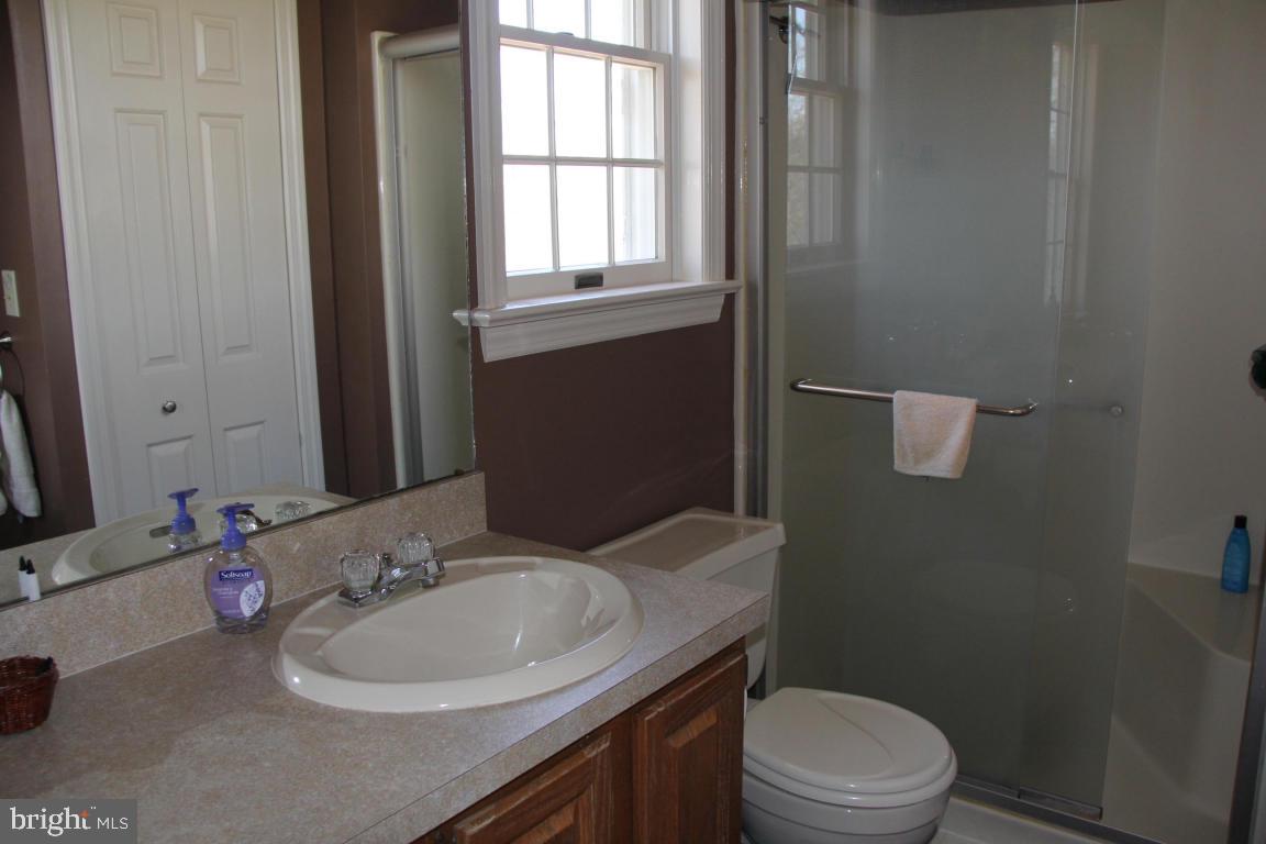 3 Warren Circle Lititz, PA 17543 - Photo 15 of 27 a bathroom with a sink toilet a mirror and shower