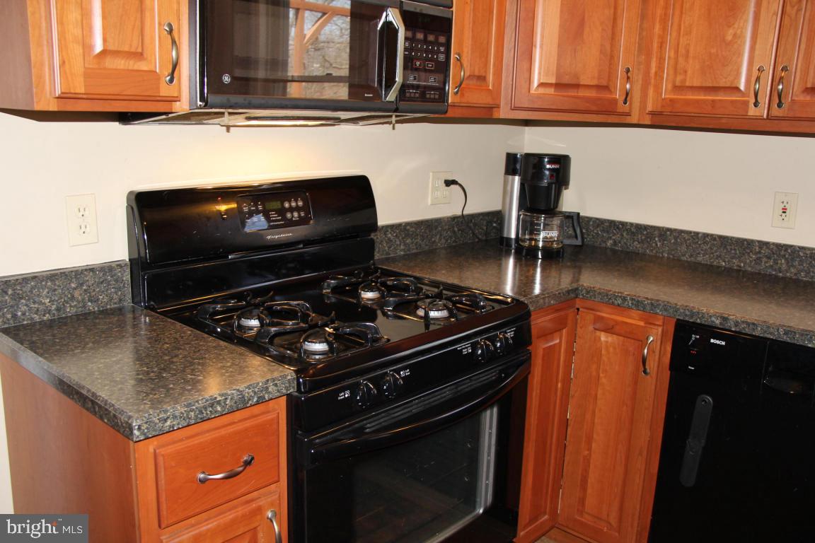 3 Warren Circle Lititz, PA 17543 - Photo 6 of 27 a kitchen with stainless steel appliances granite countertop a stove and a microwave