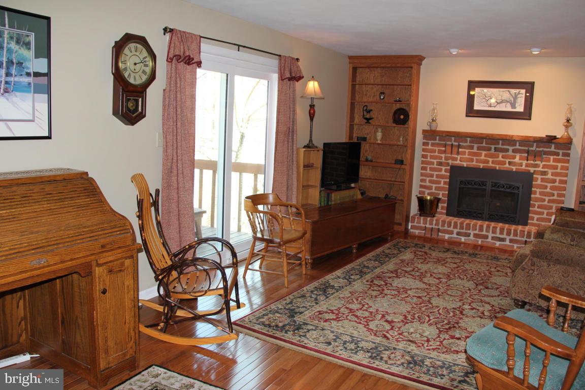 3 Warren Circle Lititz, PA 17543 - Photo 8 of 27 a living room with furniture a rug and a fireplace