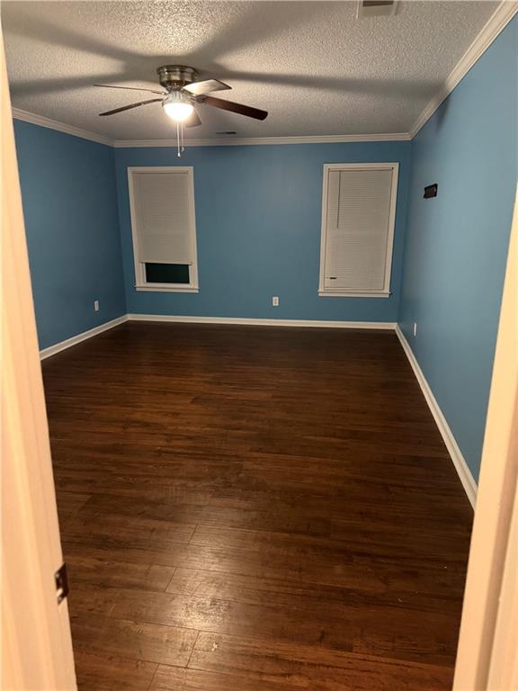 2725 Milton Bryan Drive Loganville, GA 30052 - Photo 8 of 11 a view of an empty room with wooden floor and a window