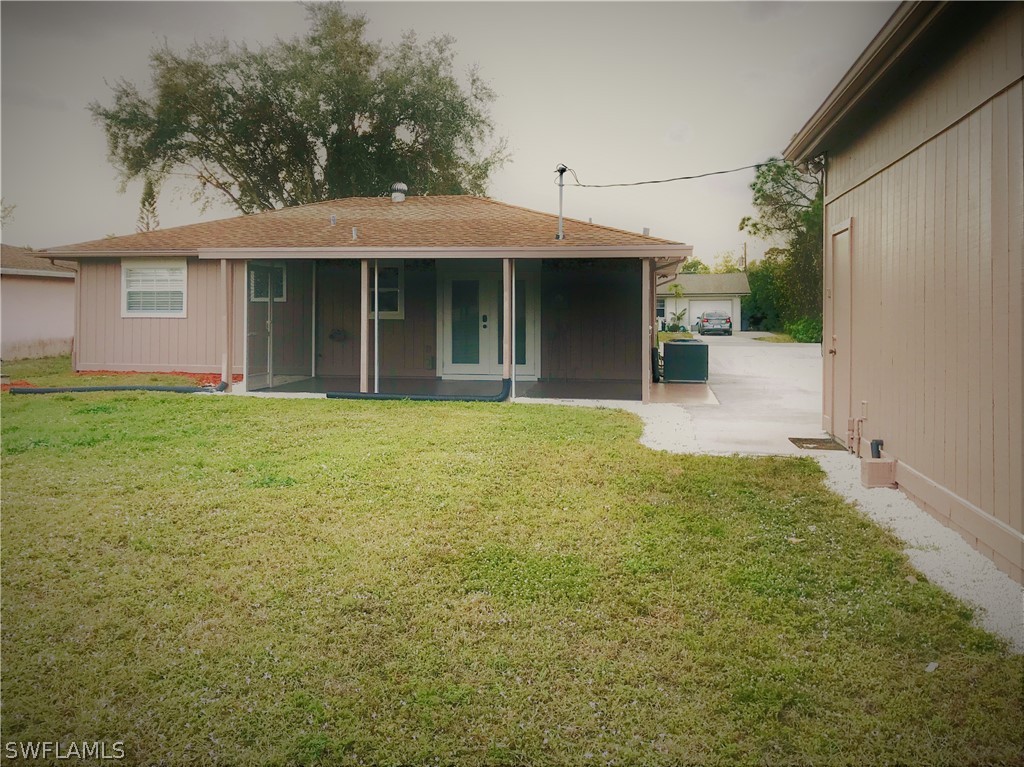 18449 Flamingo Road Fort Myers, FL 33967 - Photo 18 of 20 a view of a yard in front of a house