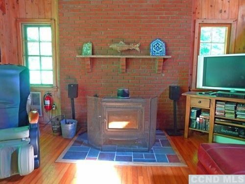 161 Stagecoach Road Hillsdale, NY 12529 - Photo 9 of 10 a living room with furniture and a fireplace