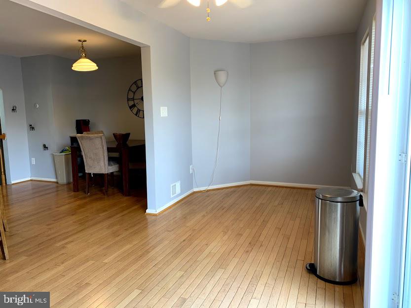79 Millstream Road Pine Hill, NJ 08021 - Photo 23 of 43 a view of room with wooden floor and chair