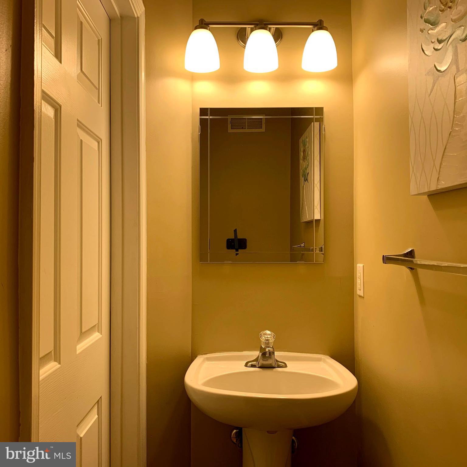 79 Millstream Road Pine Hill, NJ 08021 - Photo 5 of 43 a bathroom with a sink and a mirror