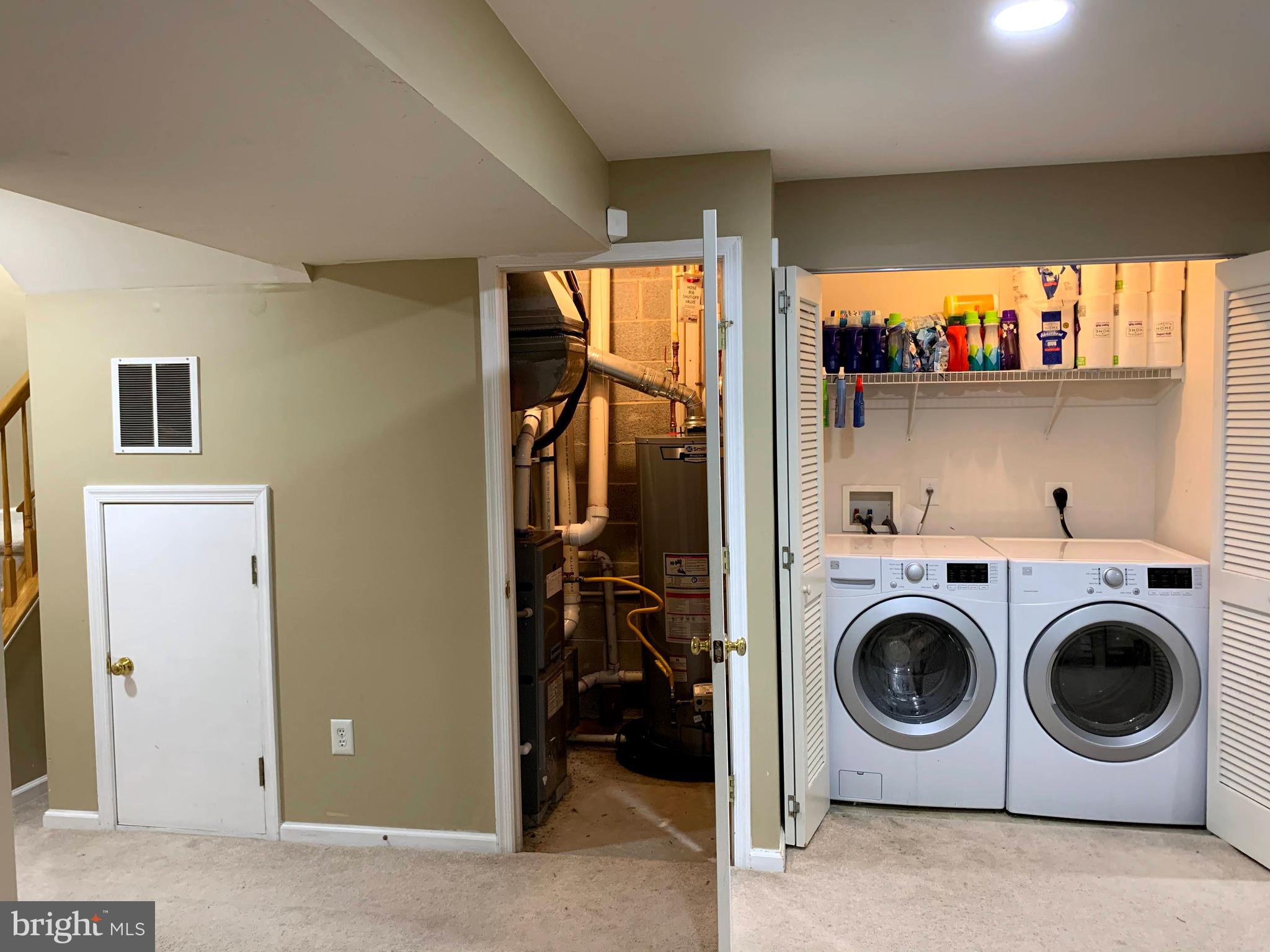 79 Millstream Road Pine Hill, NJ 08021 - Photo 7 of 43 a utility room with dryer washer and view of living room