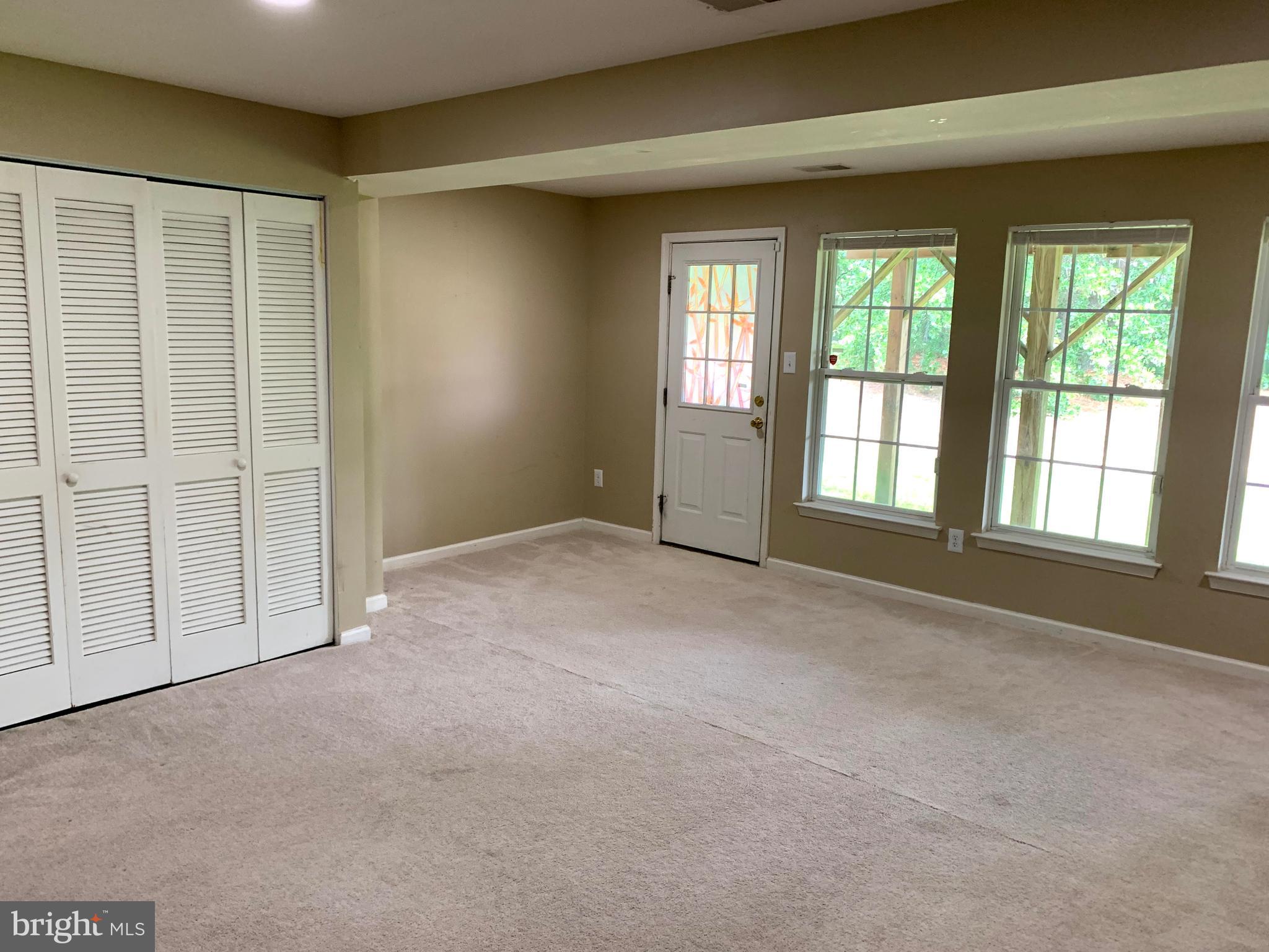 79 Millstream Road Pine Hill, NJ 08021 - Photo 10 of 43 an empty room with windows