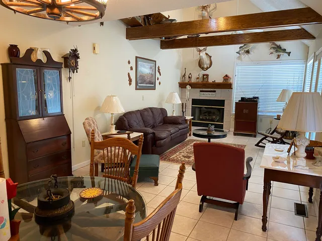 a front view of a house with entryway and wooden floor