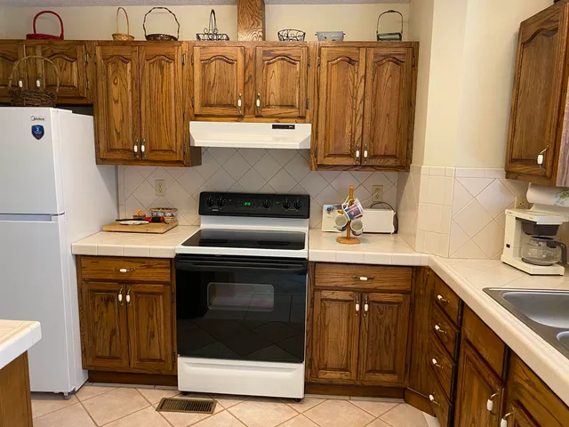 a bathroom with a toilet a sink and a shower