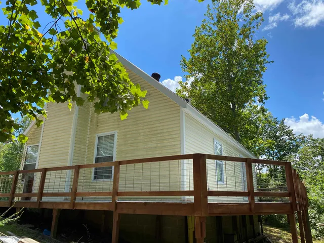 a big yard with large trees