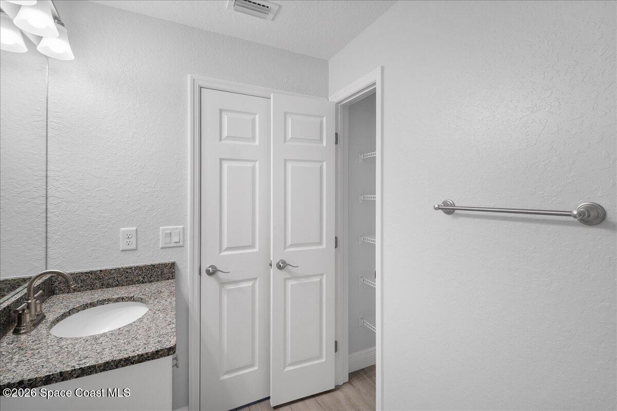 533 Fellenz Street Palm Bay, FL 32908 - Photo 35 of 42 35. Guest Bathroom Linen Closet