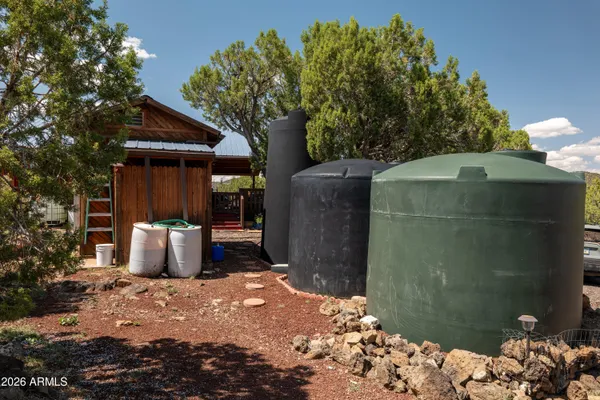 a view of a backyard with sitting area