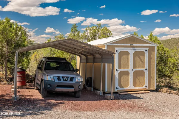 a view of a city from a balcony with furniture