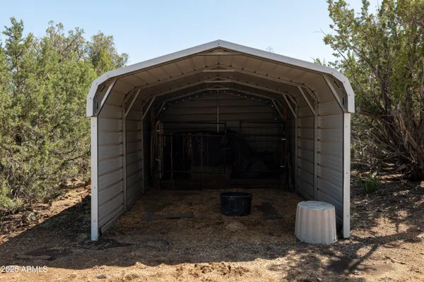 a view of balcony with chairs and wooden floor