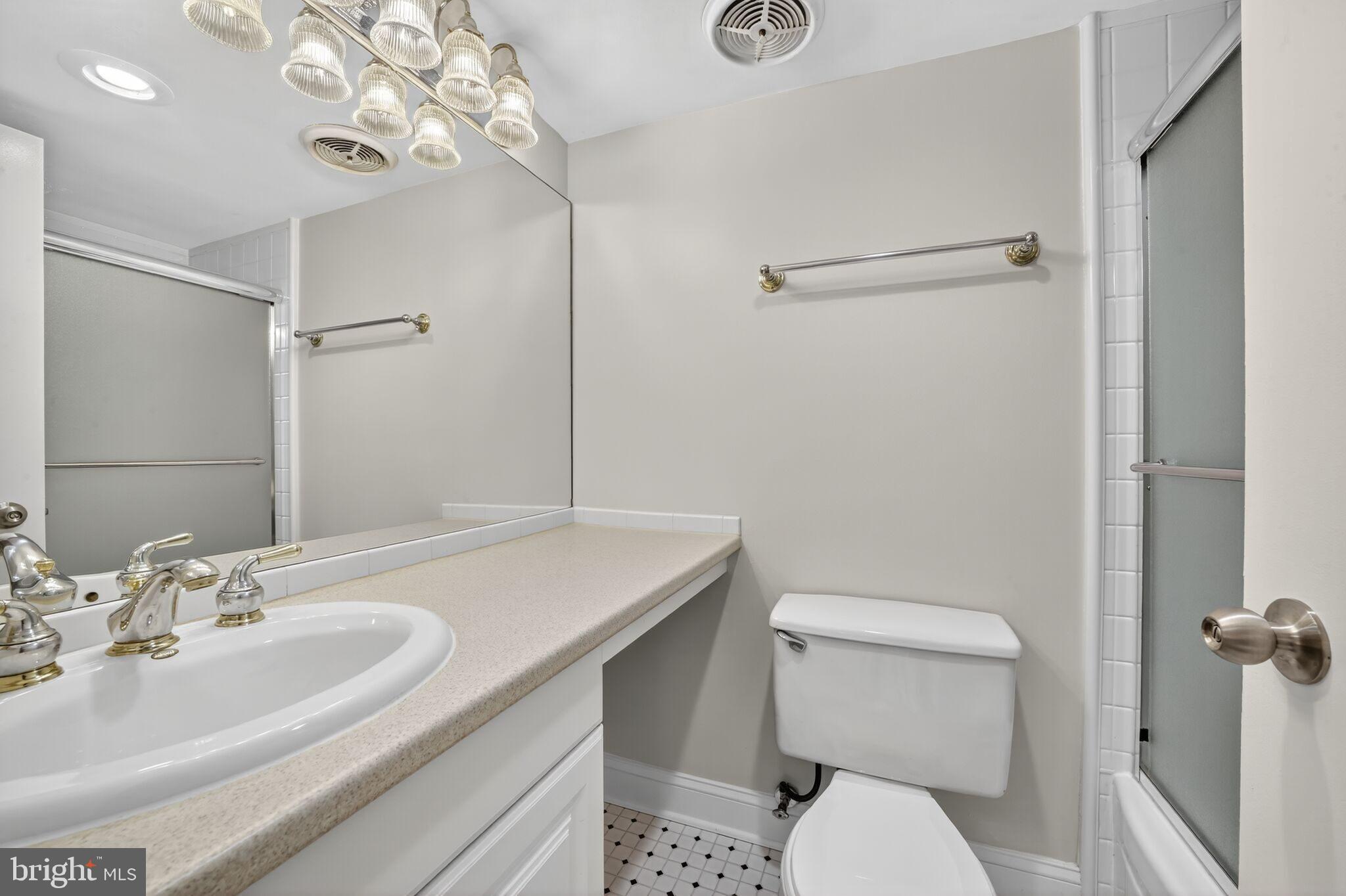 1245 13th Street Northwest, Unit 304 Washington, DC 20005 - Photo 15 of 43 a bathroom with a sink toilet and shower