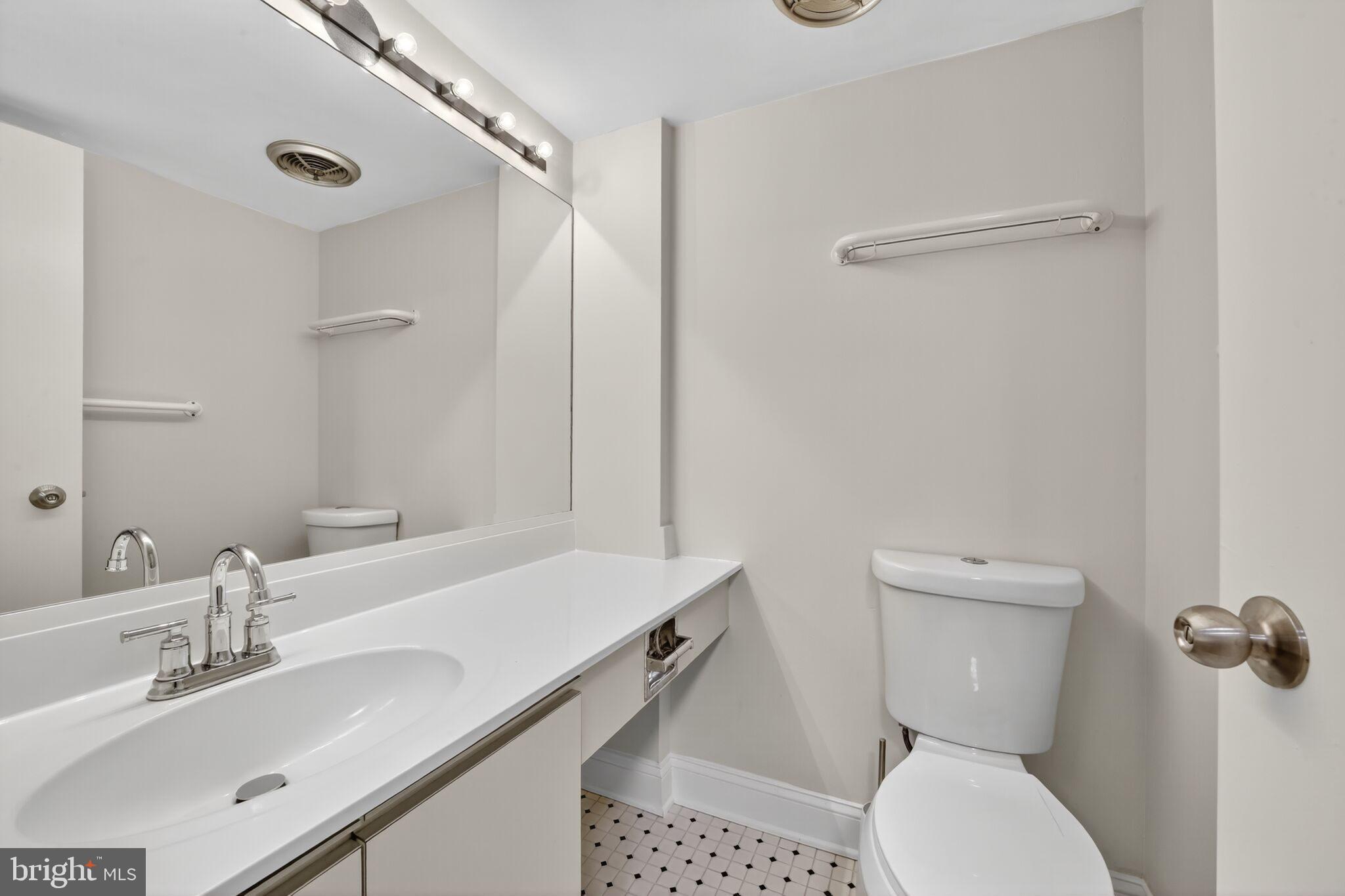 1245 13th Street Northwest, Unit 304 Washington, DC 20005 - Photo 3 of 43 a bathroom with a sink toilet and shower