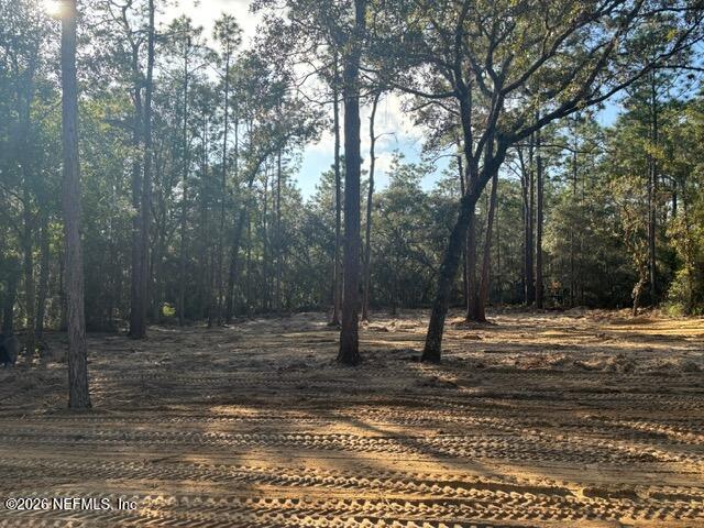 409 Edgehill Road Satsuma, FL 32189 - Photo 4 of 4 a house with trees in the background