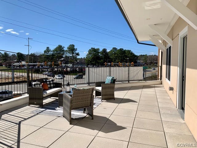 1504 Ewing Park Loop, Unit 203 Midlothian, VA 23113 - Photo 16 of 17 a view of a terrace with furniture and rug