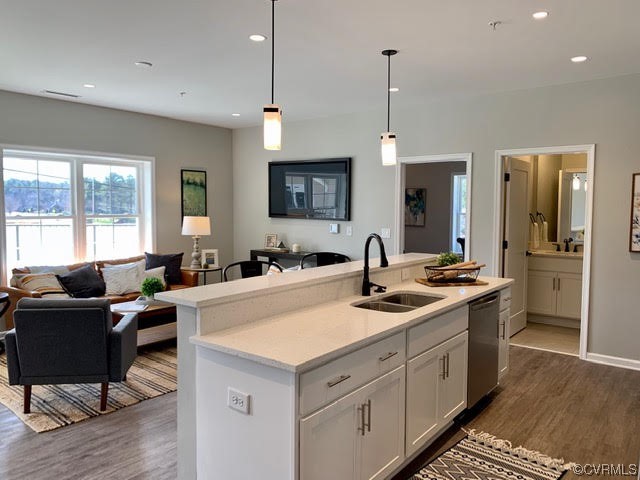 1504 Ewing Park Loop, Unit 203 Midlothian, VA 23113 - Photo 2 of 17 a kitchen with a sink stove and wooden floor